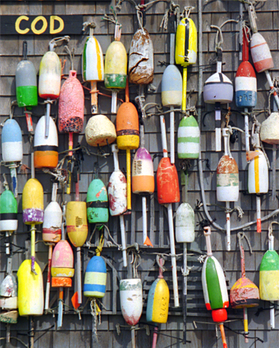 Fishing floats hung on a wall at Cape Cod, Massachusetts, USA photographed by artist Trevor Heath