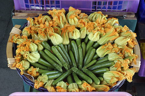 Courgettes in a market on the Via Garibaldi, Venice, Italy photographed by artist Trevor Heath
