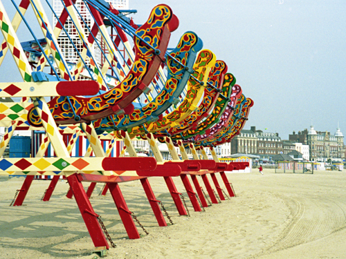 Swingboats, early morning, Weymouth beach, Dorset photographed by pop artist Trevor Heath