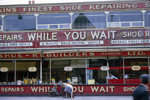 While You Wait Shoe Repairs shop in Stockwell, South London photographed by pop artist Trevor Heath